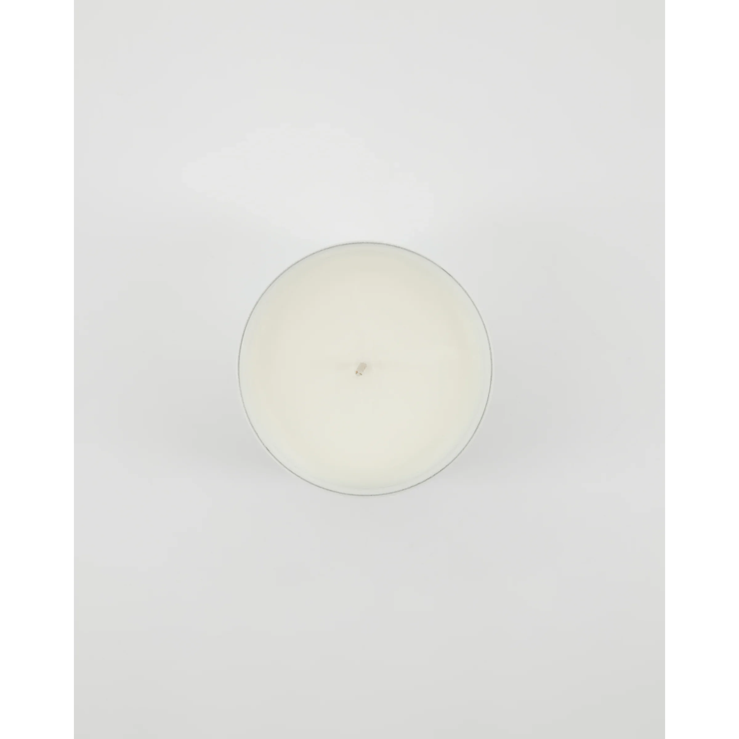 Bovenaanzicht van Meraki Fresh Linen geurkaars met witte was en ongebrande lont
